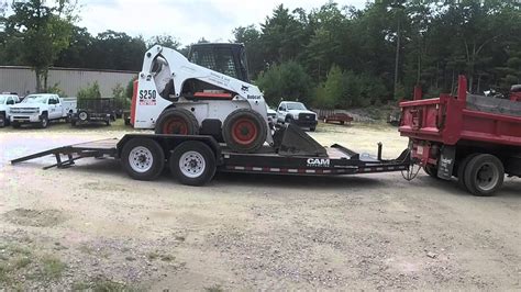 skid steer loading tree on trailer fail|bobcat loading on trailer.